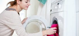 Housework: young woman doing laundry