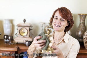Woman polishing antiques