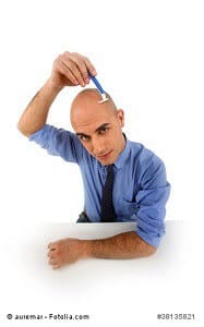 Man shaving head