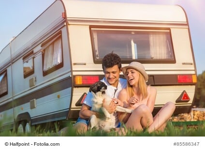 Young couple with a camper van